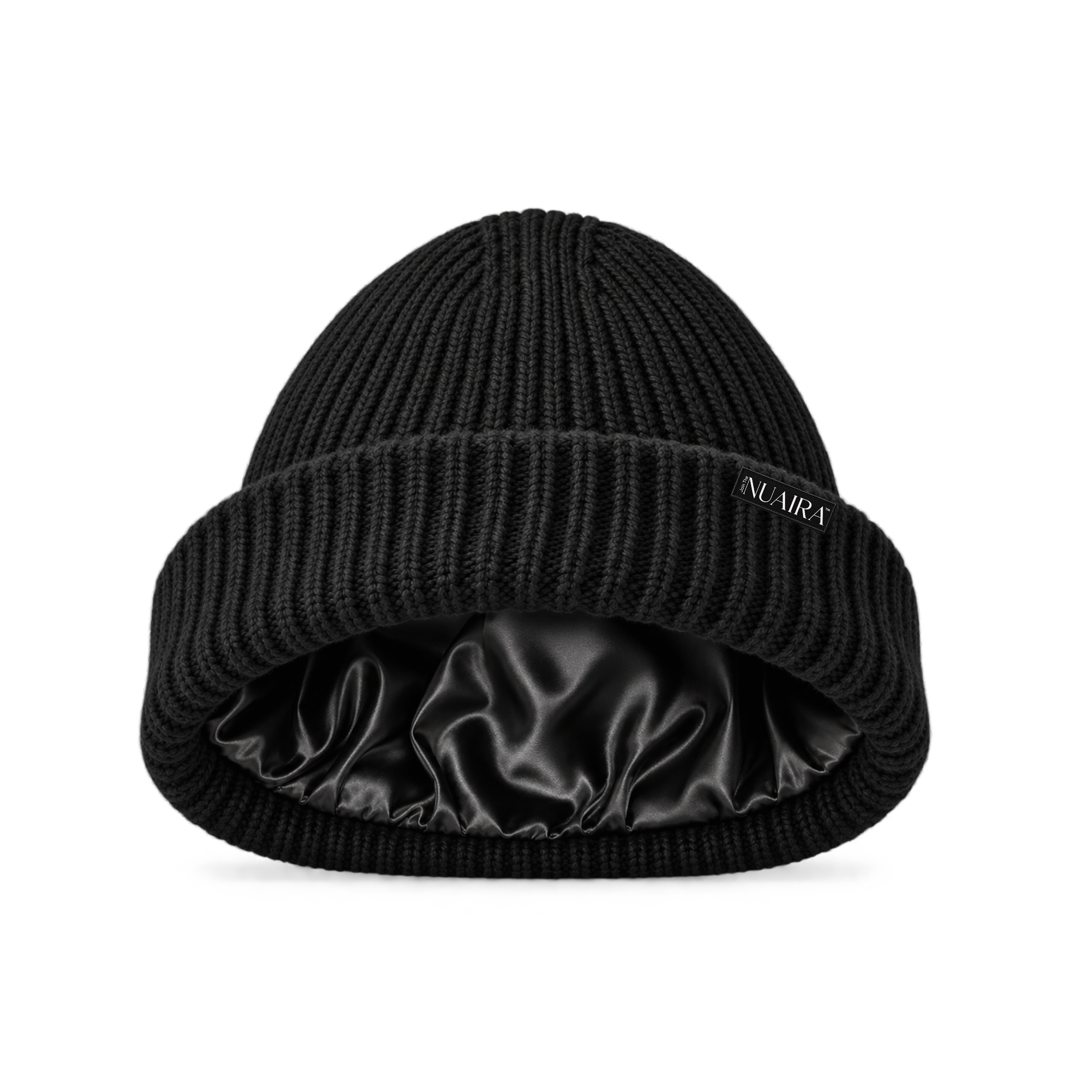 A black ribbed knit beanie hat with a shiny black satin inner lining, shown on a white background with a black NUAIRA brand tag in the lower left corner.