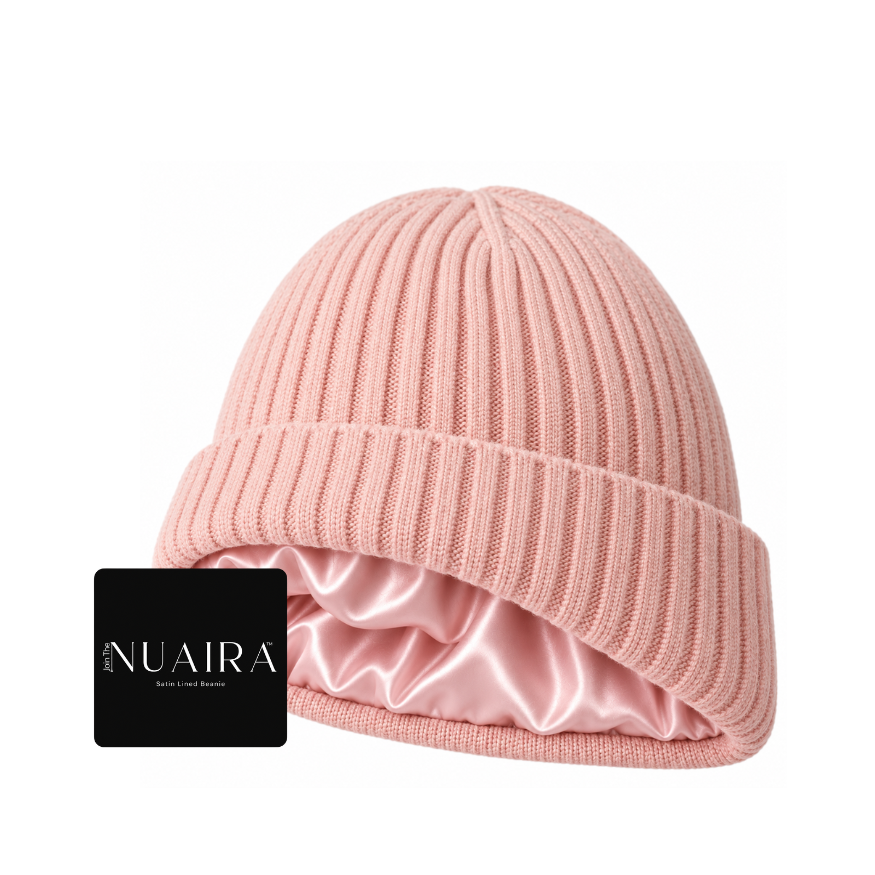 A light pink ribbed knit beanie hat with a matching satin inner lining classic cuff wool-like feel by NUAIRA 