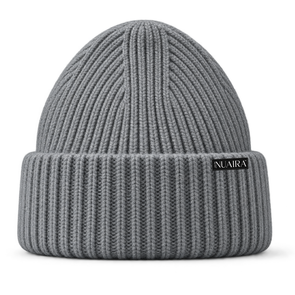 A grey ribbed knit beanie hat with a shiny grey satin inner lining, shown on a white background with a grey NUAIRA brand tag in the lower left corner.