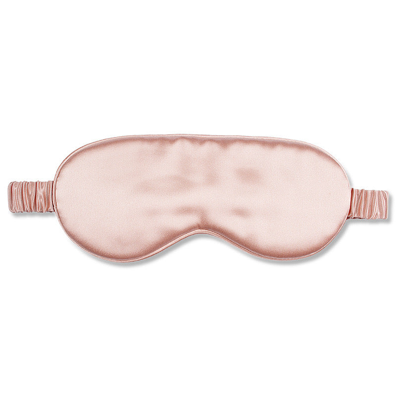 Luxurious, pink silky-smooth eye mask. The soft padding lays effortlessly on your face, Perfect for travel, daytime naps.