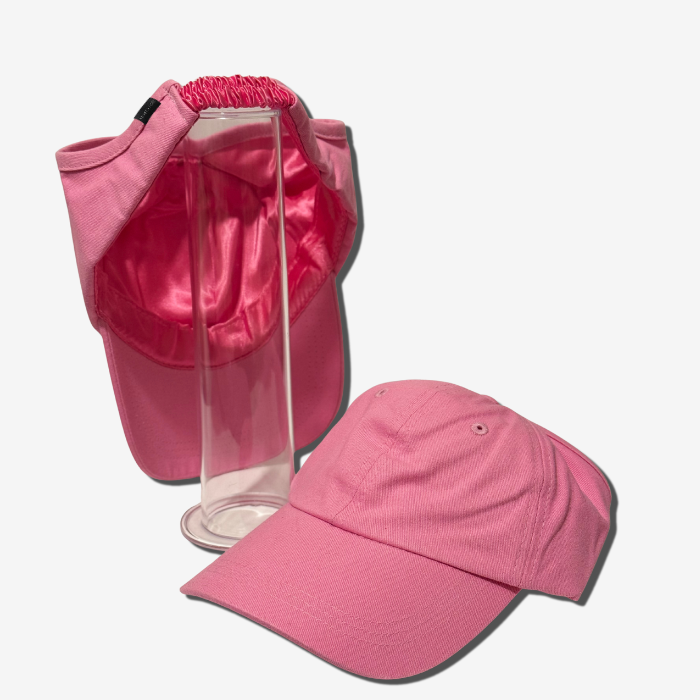 Pink cap and visor set on a white background