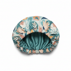 NuAira Floral Pastel satin fabric swatch – soft teal blush and cream botanical print for hair bonnet